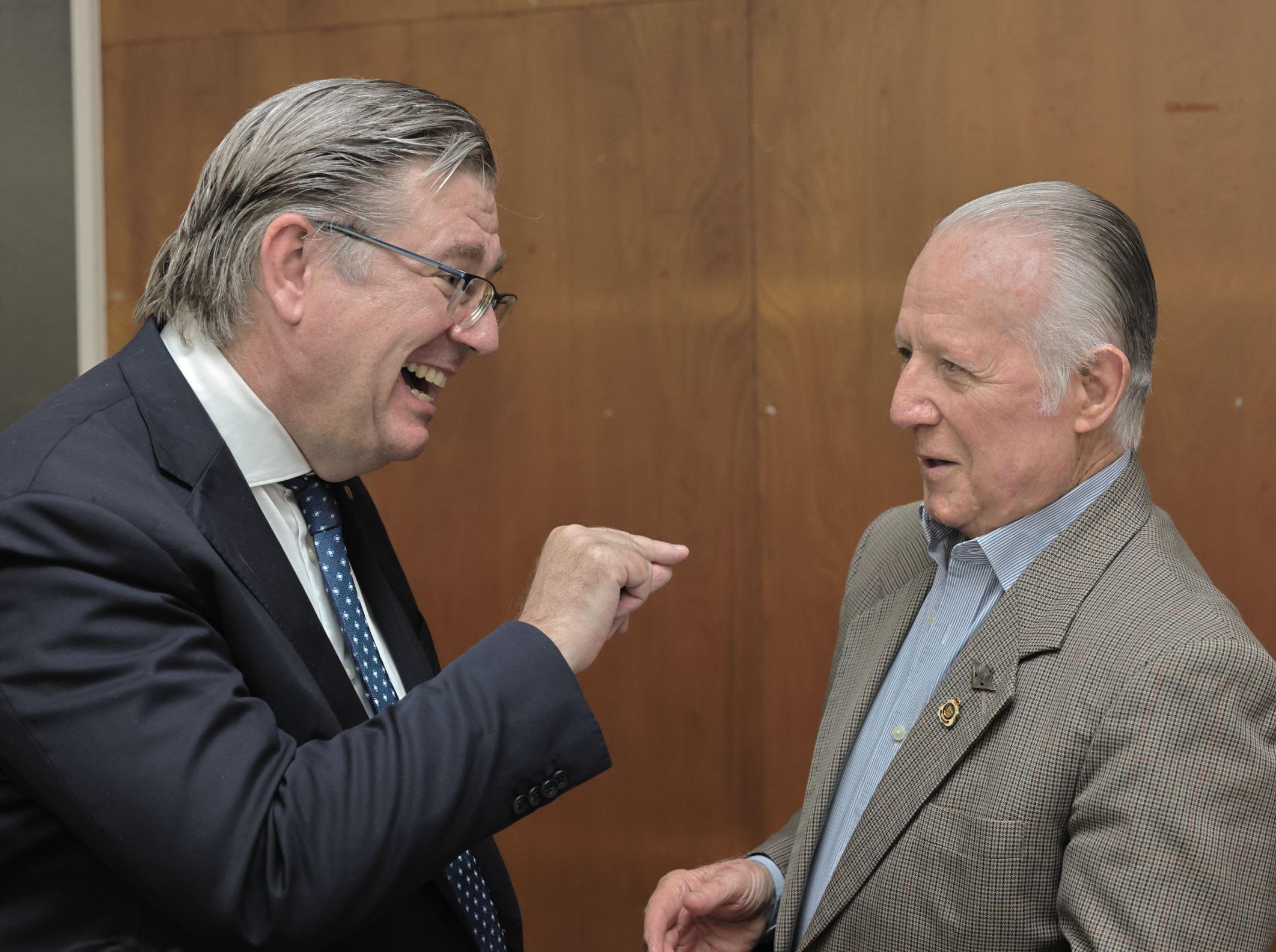 Two supporters sharing a laugh at the gathering